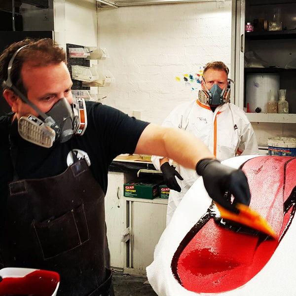 Adding red resin tint to a surfboard in Melbourne Victoria Australia