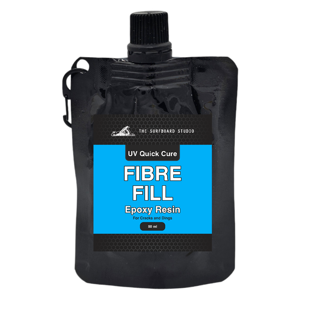Black pouch of Fibre Fill Epoxy Resin with blue label on a white background. For surfboard and marine application repairs.